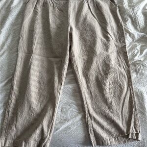 CJ Banks capri pants. Khaki with thin black stripe. Never worn